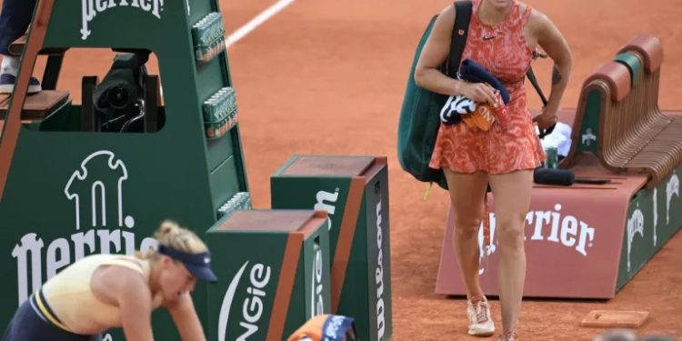 'Not 100%': Aryna Sabalenka leaves the court after her defeat to Mirra Andreeva at the French Open (Bertrand GUAY)/AFP