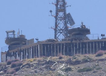 A damaged Israeli military position targeted by Hezbollah fighters is seen on the top of Mount Hermon in the Israeli-controlled Golan Heights, where the borders between Israel, Syria and Lebanon meet, is seen from Chebaa, a Lebanese town near the border with Israel, south Lebanon, June 26, 2024. U.S., European and Arab mediators are pressing to keep stepped-up cross-border attacks between Israel and Lebanon’s Hezbollah militants from spiraling into a nightmare Middle East-wide war that the world has feared for months. (AP Photo/Hussein Malla, File)