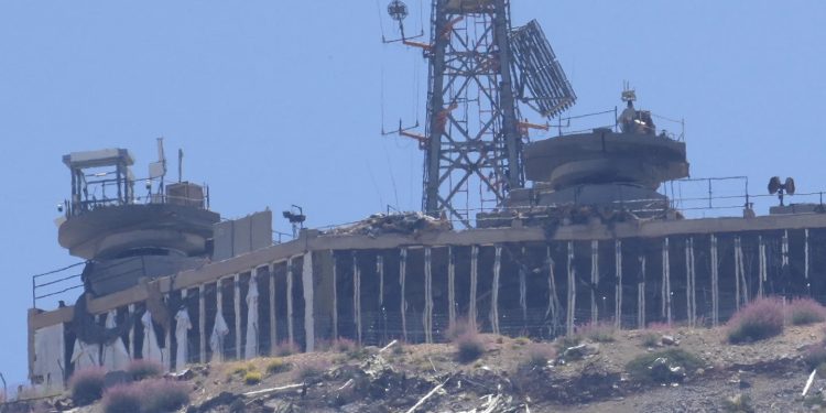 A damaged Israeli military position targeted by Hezbollah fighters is seen on the top of Mount Hermon in the Israeli-controlled Golan Heights, where the borders between Israel, Syria and Lebanon meet, is seen from Chebaa, a Lebanese town near the border with Israel, south Lebanon, June 26, 2024. U.S., European and Arab mediators are pressing to keep stepped-up cross-border attacks between Israel and Lebanon’s Hezbollah militants from spiraling into a nightmare Middle East-wide war that the world has feared for months. (AP Photo/Hussein Malla, File)