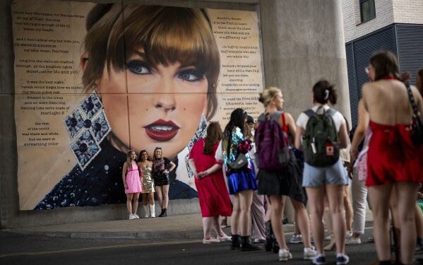 Taylor Swift fans pose with their bracelets infront of the “Swiftie Steps”, commissioned by London Mayor Sadiq Khan, before the first London concert of the Eras Tour on Friday, June 21, 2024 in London. (Photo by Scott A Garfitt/Invision/AP)