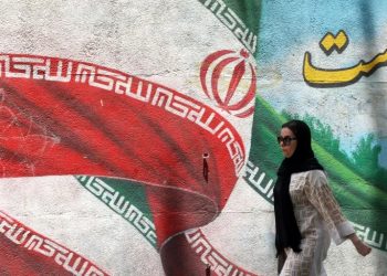 A reformist and an ultraconservative face each other in Friday's Iranian presidential election runoff (ATTA KENARE)/AFP