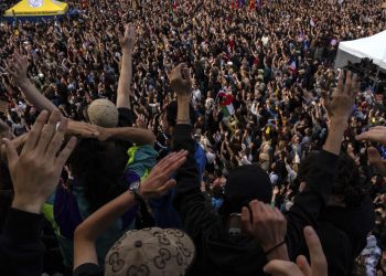People gather at Republique plaza in a protest against the far-right, Wednesday, July 3, 2024, in Paris. French opposition parties and associations are trying to block a landslide victory for Marine Le Pen's far-right National Rally in next Sunday's second round of legislative elections. (AP Photo/Louise Delmotte)