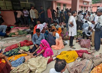 [3/3] SENSITIVE MATERIAL. THIS IMAGE MAY OFFEND OR DISTURB People mourn next to the bodies of victims of a stampede outside a hospital in Hathras district in the northern state of Uttar Pradesh, India, July 2, 2024. REUTERS