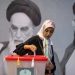 A woman casts her vote at a polling station during the run-off election for the Iranian presidential elections. Arne Bänsch/dpa