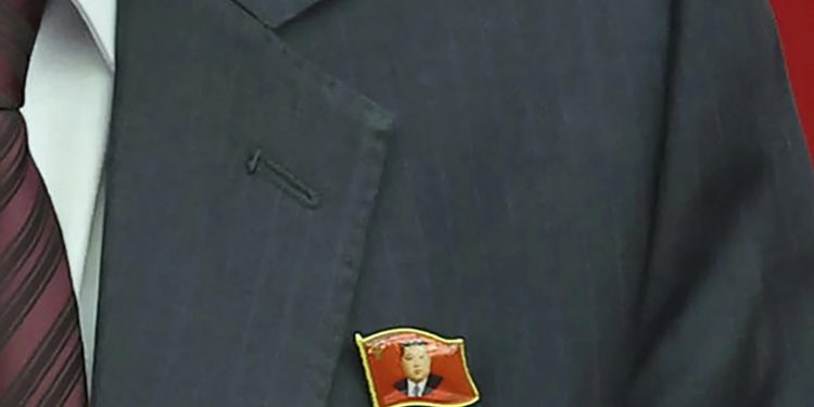 1 of 2 | This photo provided Monday, July 1, 2024, by the North Korean government shows that a senior official wears lapel pins with the image of Kim Jong Un during a ruling party’s meeting in Pyongyang Sunday, June 30, 2024. Independent journalists were not given access to cover the event depicted in this image distributed by the North Korean government. The content of this image is as provided and cannot be independently verified. (Korean Central News Agency/Korea News Service via AP)