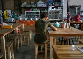 Tens of thousands of young people rights groups estimate have fled Myanmar since the military introduced conscription (Lillian SUWANRUMPHA)/afp