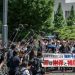Lawyers and supporters of victims of forced sterilisation under a now-defunct eugenics law, carrying a banner demanding apologies and compensations, march toward the Supreme Court of Japan in Tokyo (Yuichi YAMAZAKI)/AFP