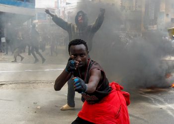 A man gestures during a demonstration over police killings of people protesting against the imposition of tax hikes by the government, in Nairobi, Kenya. REUTERS/Monicah Mwangi