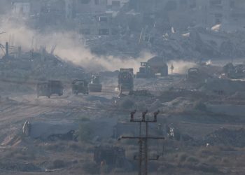 Israeli military vehicles and machinery drive inside Gaza, near the Israel-Gaza border, amid the Israel-Hamas conflict, as seen from Israel, July 3, 2024. REUTERS/Amir Cohen