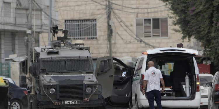 Members of the Israeli forces inside an armoured vehicle check an ambulance during a military operation in the West Bank city of Jenin, Wednesday, Aug. 28, 2024. (AP Photo/Majdi Mohammed)ASSOCIATED PRESS