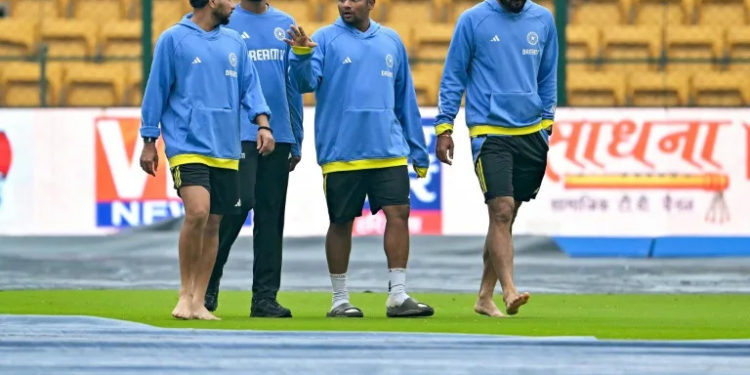 Rain delays New Zealand chase of 107 to beat India in first Test