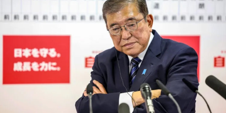 Japan PM vows to stay on despite election debacle