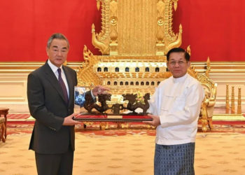 This photograph taken and released in August, 2024 by the Myanmar Military Information Team shows Myanmar's military chief Min Aung Hlaing (right) meeting with China's Foreign Minister Wang Yi in Nyapyidaw. China is a key ally of the military junta (-) (-/MYANMAR MILITARY INFORMATION TEAM/AFP)