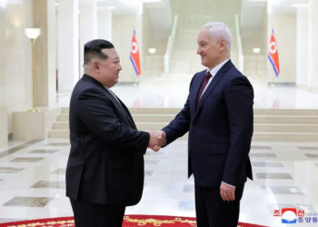 North Korean leader Kim Jong Un (L) greets Russian defence chief Andrei Belousov in Pyongyang (STR) (STR/KCNA VIA KNS/AFP)