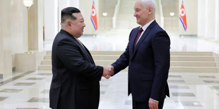 North Korean leader Kim Jong Un (L) greets Russian defence chief Andrei Belousov in Pyongyang (STR) (STR/KCNA VIA KNS/AFP)
