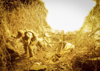In this photo provided by Ukraine’s 24th Mechanised Brigade press service, servicemen of the 24th Mechanised Brigade fire 120mm mortar towards Russian positions near Chasiv Yar town, in Donetsk region, Ukraine, Tuesday, Nov. 19, 2024. (Oleg Petrasiuk/Ukrainian 24th Mechanised Brigade via AP)