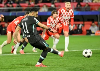 Spot on: Mohamed Salah's penalty in Girona gave Liverpool their sixth win out of six (Josep LAGO)