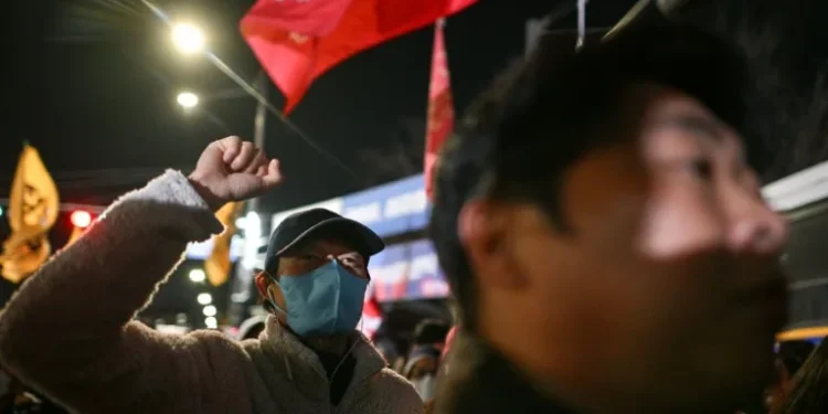 South Korean president pressed to step down over martial law bid