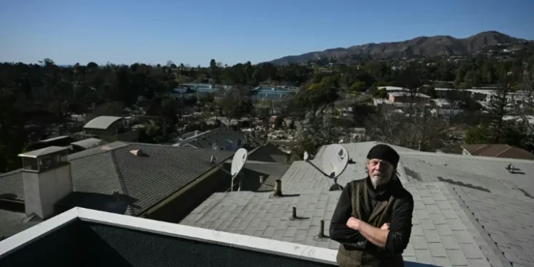 ‘Stubborn’ janitor camps out amid rubble of Los Angeles fires