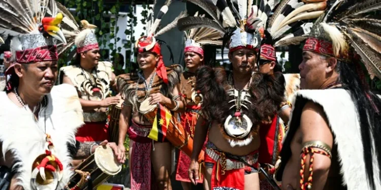 Malaysia’s Dayaks mark rice harvest end with colourful parade